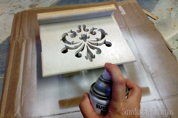 The DIY tablet and recipe book holder gets painted white!