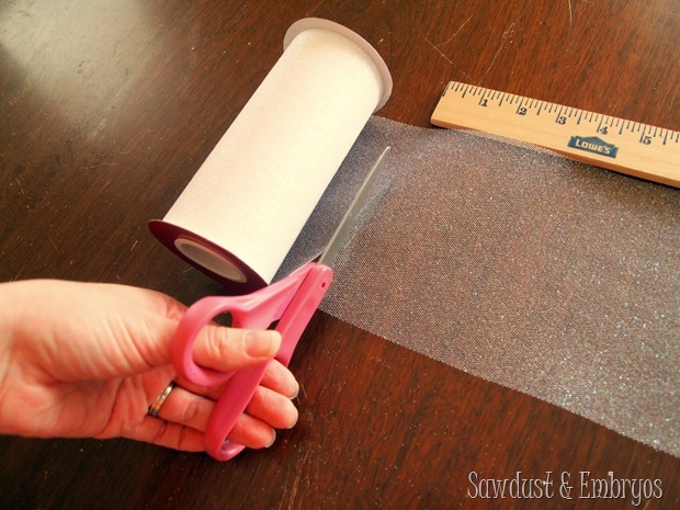 Cut tulle to varying lengths for DIY Frozen-inspired chandelier! {Sawdust and Embryos}