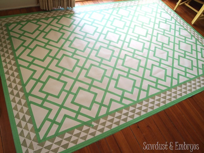 Paint a remnant of linoleum to look like a legit area rug for under your dining table!