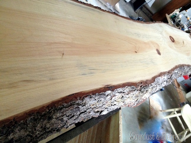 Using live edge slab of wood for countertop of breakfast bar! 