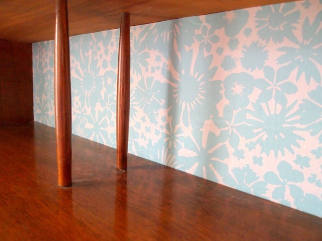 Add strips of removable wallpaper to the back of a hutch for a quick custom update! {Sawdust and Embryos}