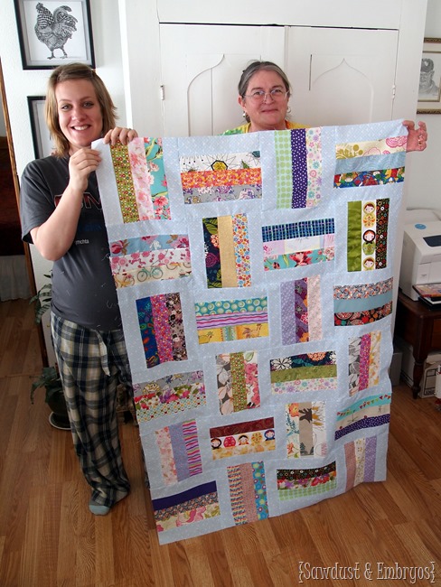 Baby quilt made from tons of pieces of scrap fabric from friends and family... so sentimental! {Sawdust and Embryos}