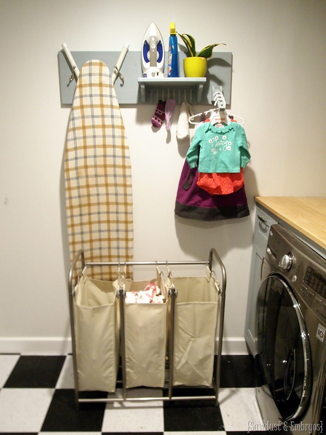 DIY Laundry Room Organizer... holds ironing board, iron, unmatched socks, and hangers {Sawdust and Embryos}