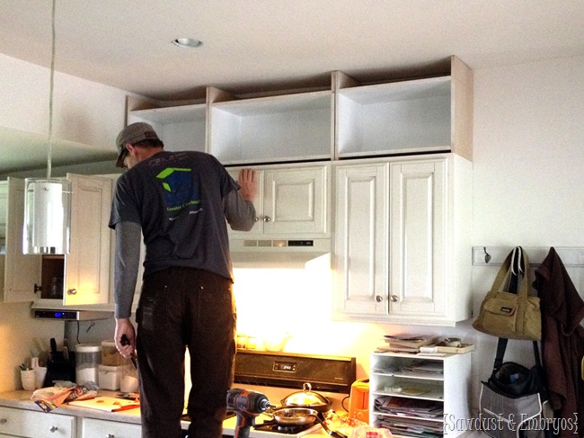 Extending kitchen cabinets to the ceiling.