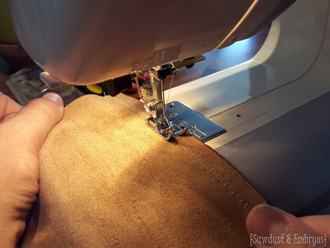 Sewing leather and prepping to upholster tufted ottoman 