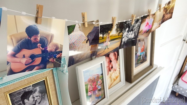 String some instragram prints below a shelf or picture ledge 